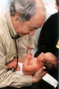 Dr Jack Newman examining a baby